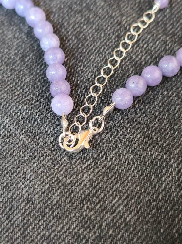 Silver clasp and chain on handmade jade necklace