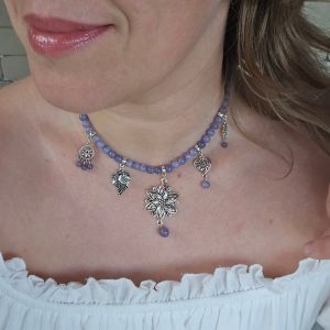 Purple jade necklace worn with white blouse