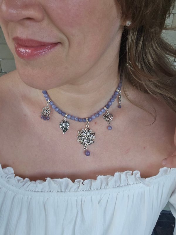 Purple jade necklace worn with white blouse