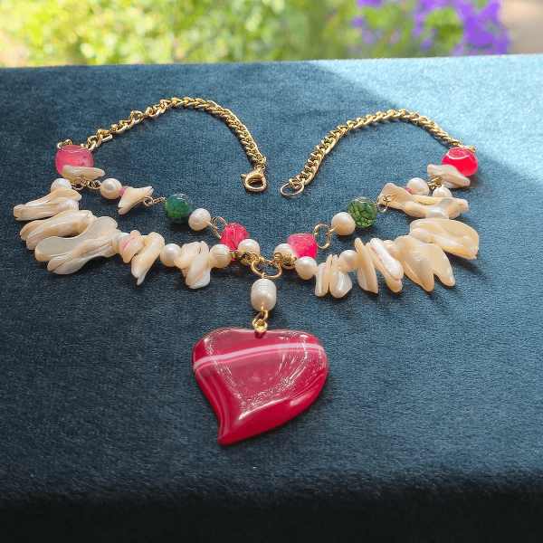 Full necklace with natural light and blurred floral background